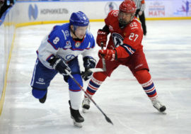 NHL players and Hockey Legends crossed sticks in Norilsk