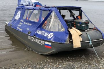 Travelers arrived in Dudinka on motorized inflatable boat